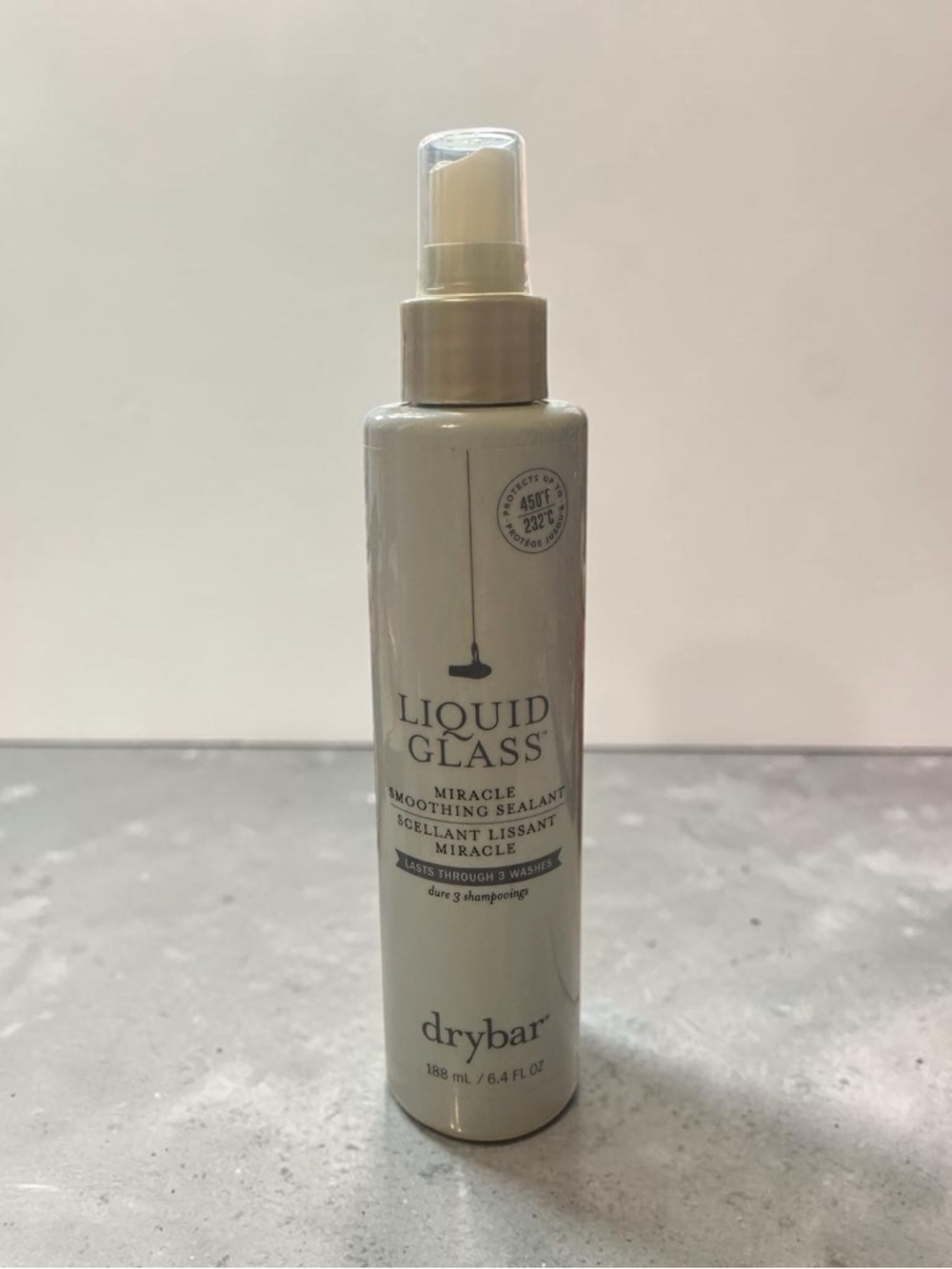 Drybar Liquid Glass Miracle Smoothing Sealant — Beige and Gold Spray Bottle